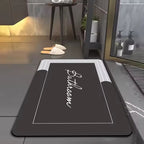 Tapis de bain Calligraphéa noir dans une douche moderne